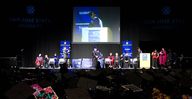 Prof. Carol Reade announces names of entrepreneurship students