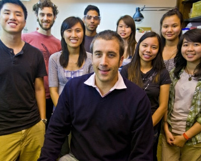 Professor of Chemistry Lionel Cheruzel with research students