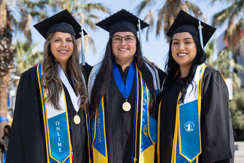 SJSU Online graduates in their grad gear.