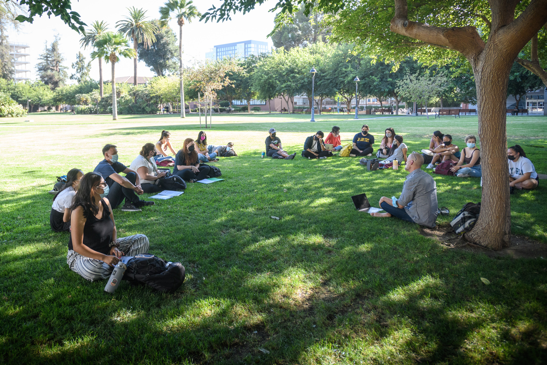 Students gathered together on the grass.