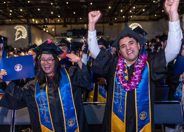 First generation graduates cheer during their commencement ceremony.