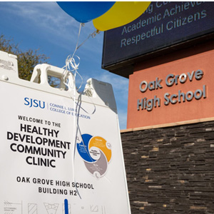 A sandwich board welcoming visitors to the clinic with location at Oakgrove High School.