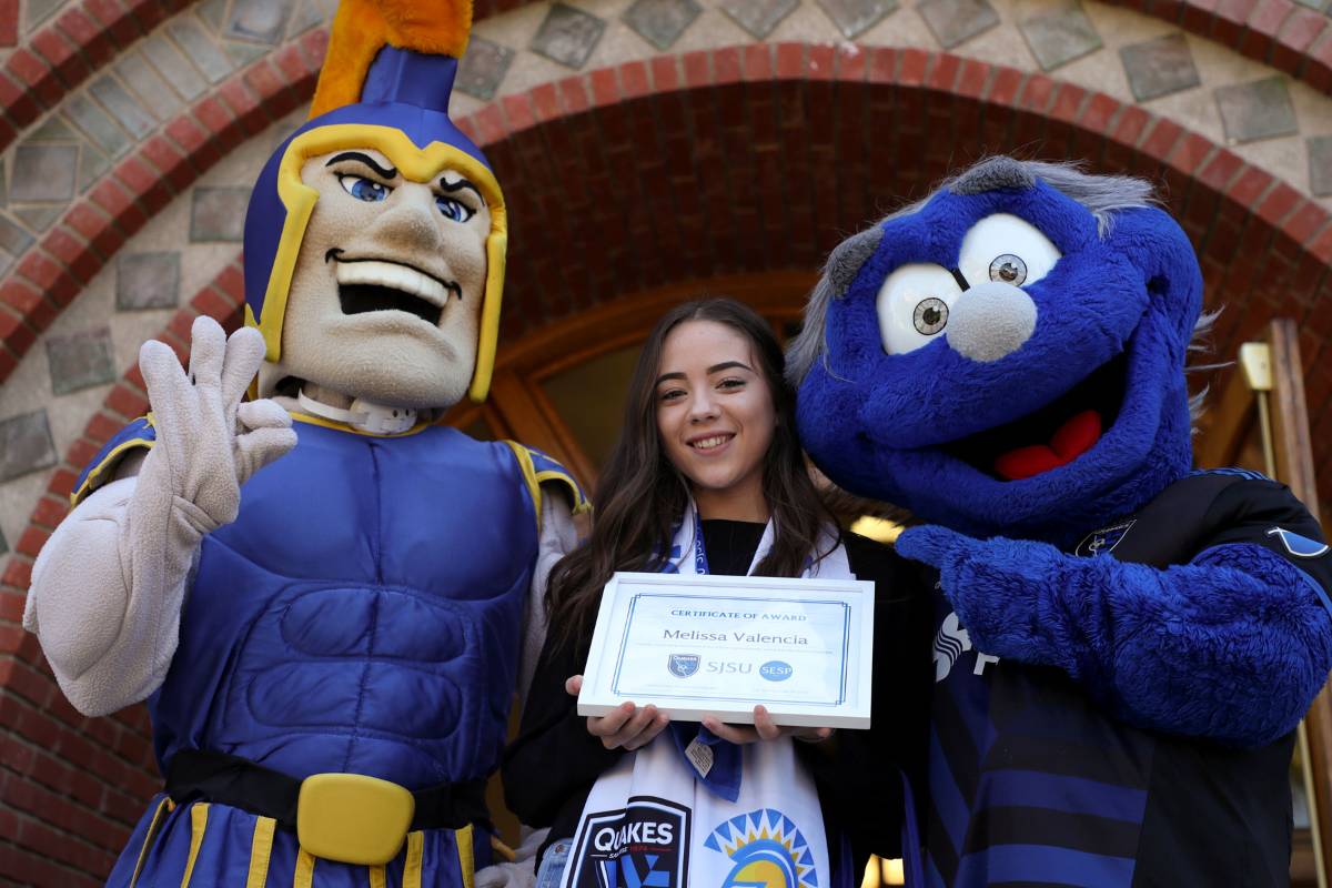 Melissa Valencia receiving a scholarship.