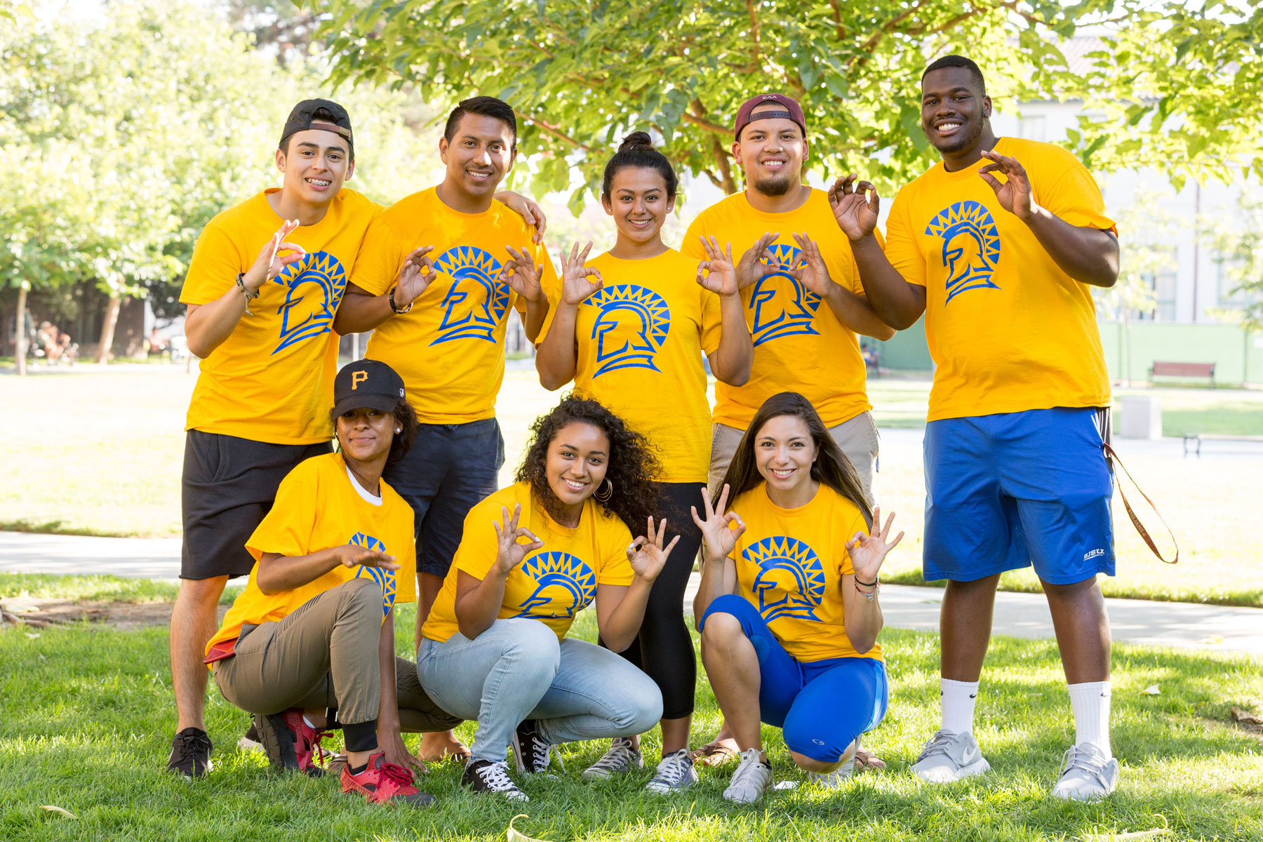 Group of SJSU students wearing yellow SJSU shirt.