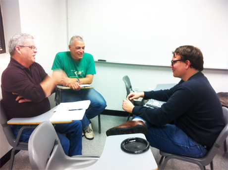 Faculty members plan their lessons at a faculty writing workshop.