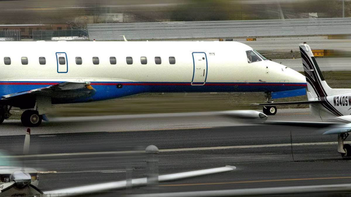 Image of a large plane landing on runway.