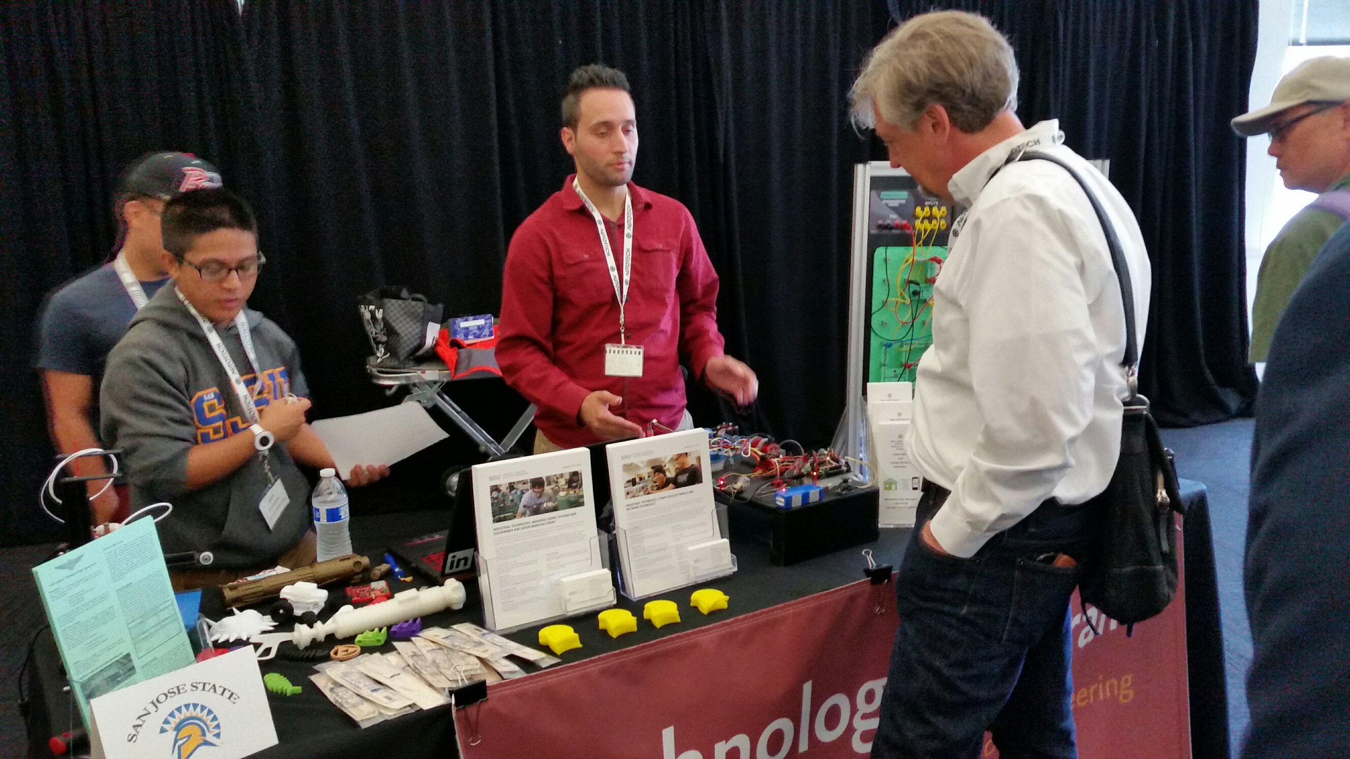 Students at a booth at the Driving Innovation Conference