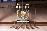 Photograph of the pedal lyre carving on the Jakesch fortepiano