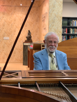 Photo of Dr. Richard Sogg at piano