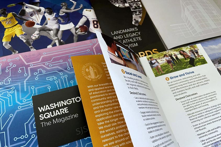 SJSU branded marketing materials displayed on the table.