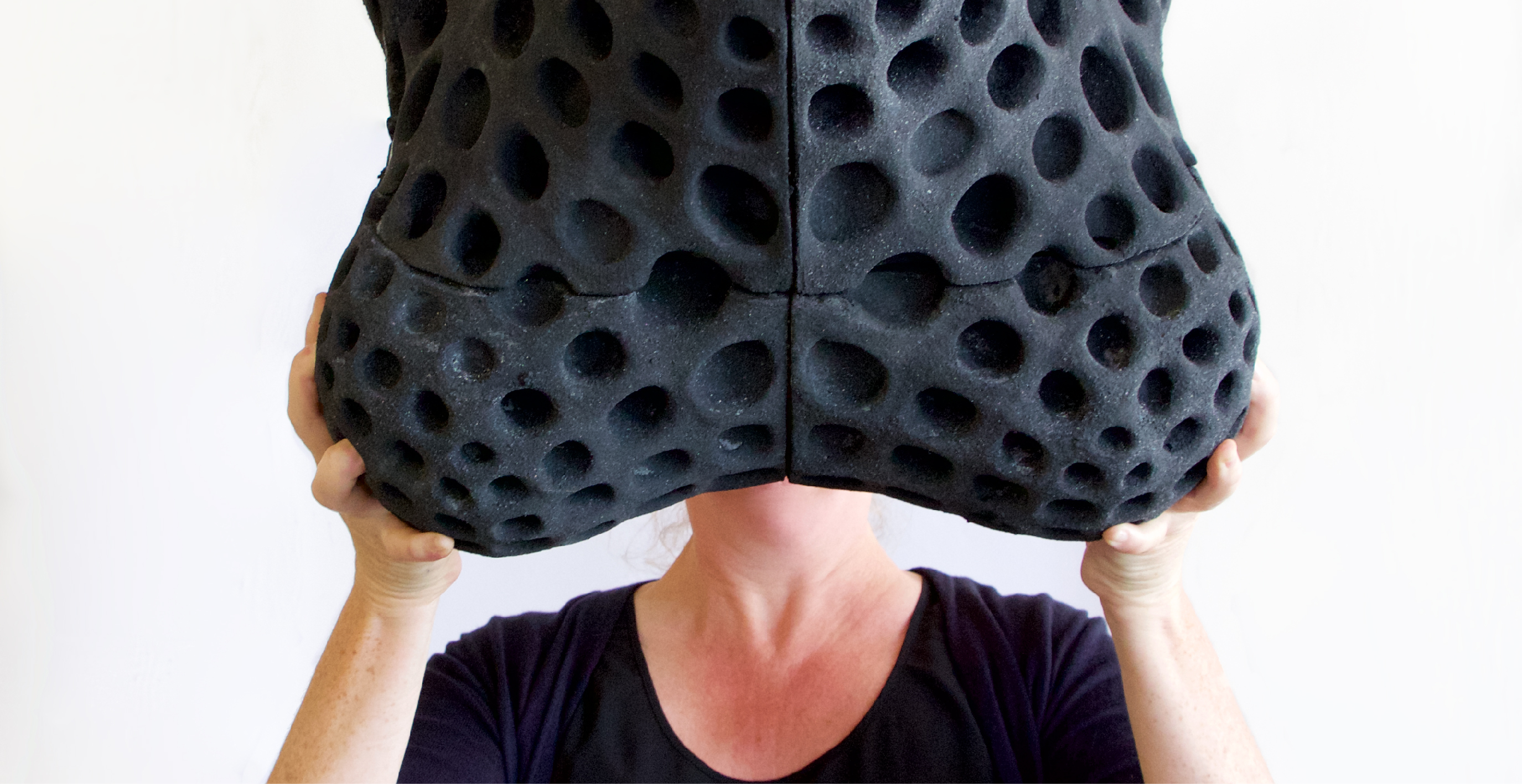 Woman holding a Rubber Design