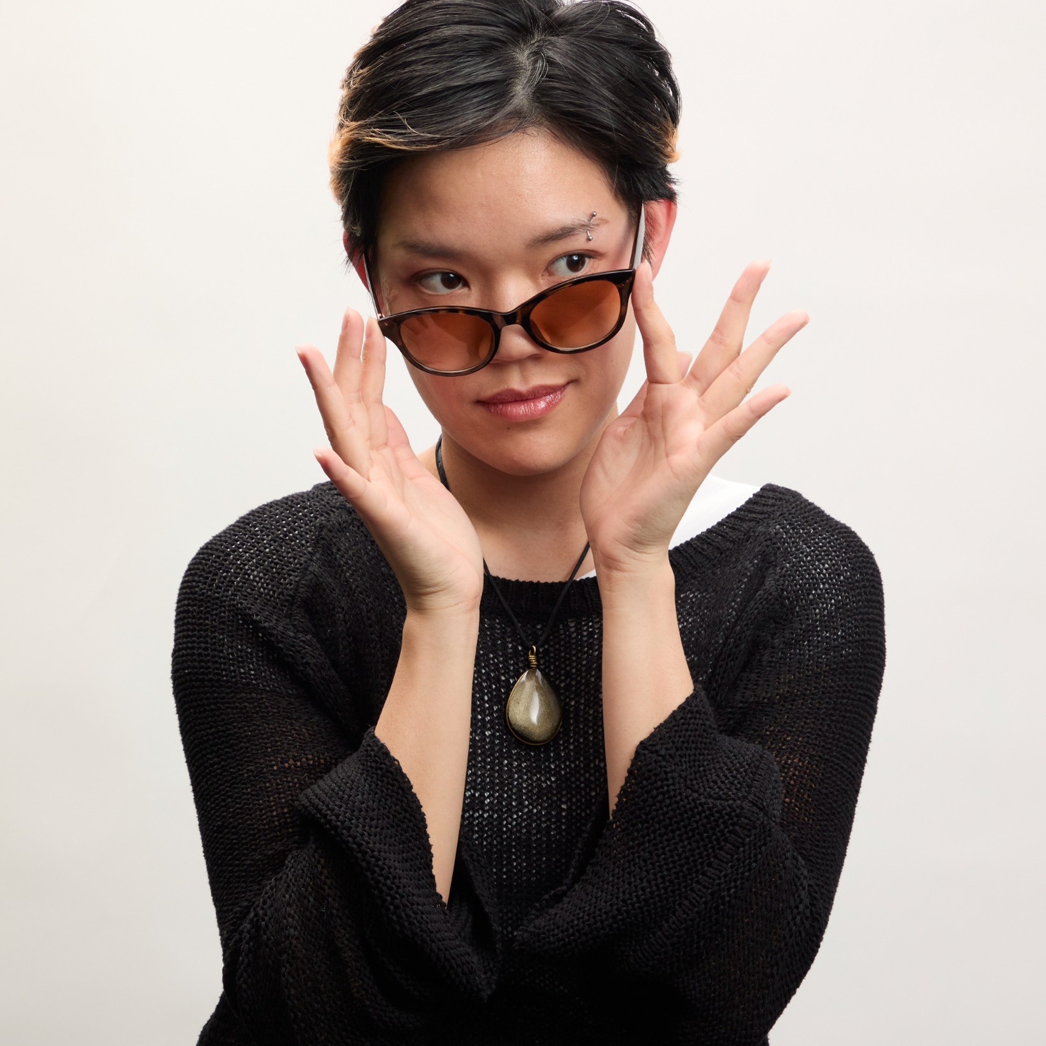 student posing with glasses - headshot