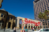 A building in downtown San José with community art project painted on it.