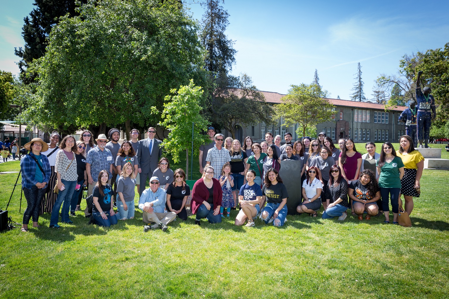 Outside photo of a large group of sustainability studies graduate students.