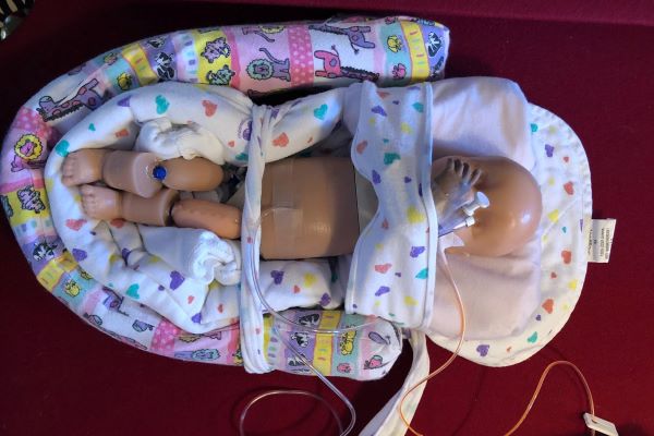 Premature infant mannequin.