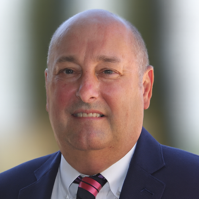 A headshot photo of Chris Wessells