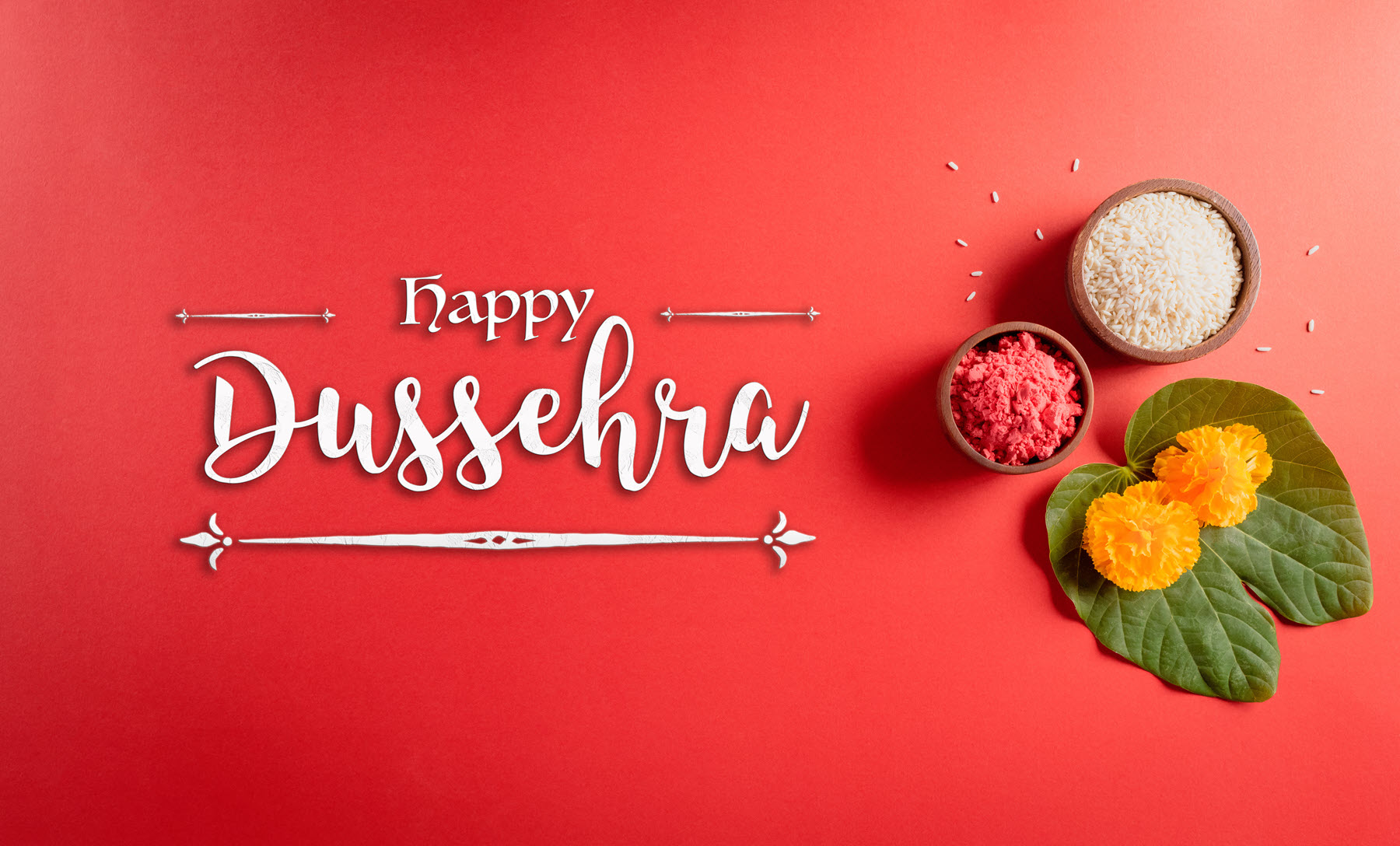 Happy Dussehra with images of bowls with food and marigold flowers atop leaves