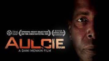 documentary film Aulcie, title + awards, and front-facing picture of Aulcie