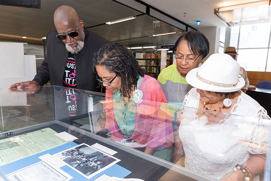 Dr. Edwards and others look at his collection.
