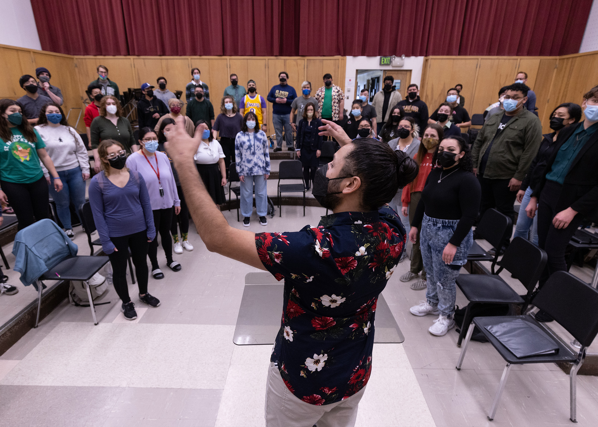 A student practicing conducting.