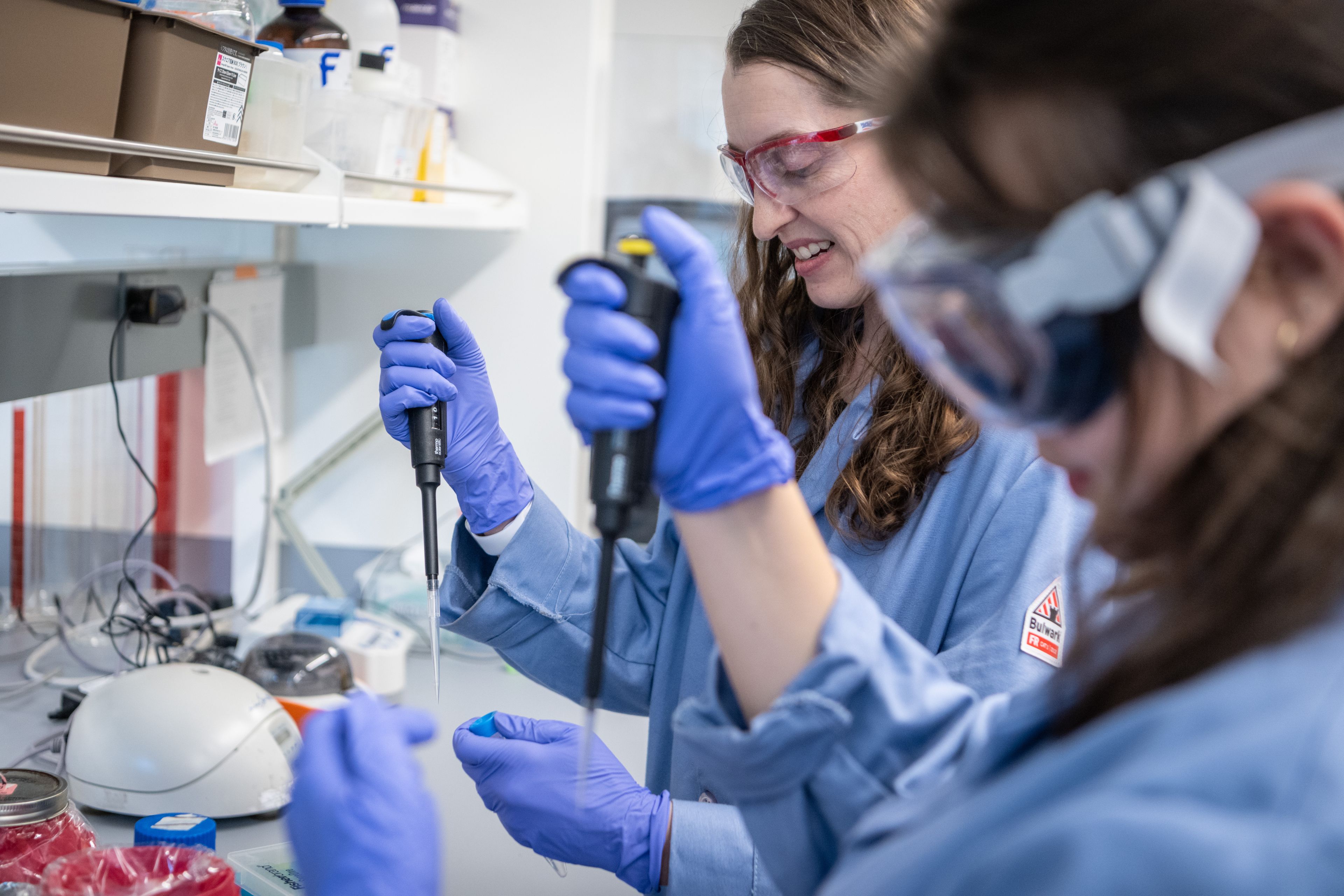 Professor Laura Miller Conrad and student researcher pipette in her research lab. science, student researcher, STEM, ISB Interdisciplinary Science Building, SJSU College of Science, undergraduate research