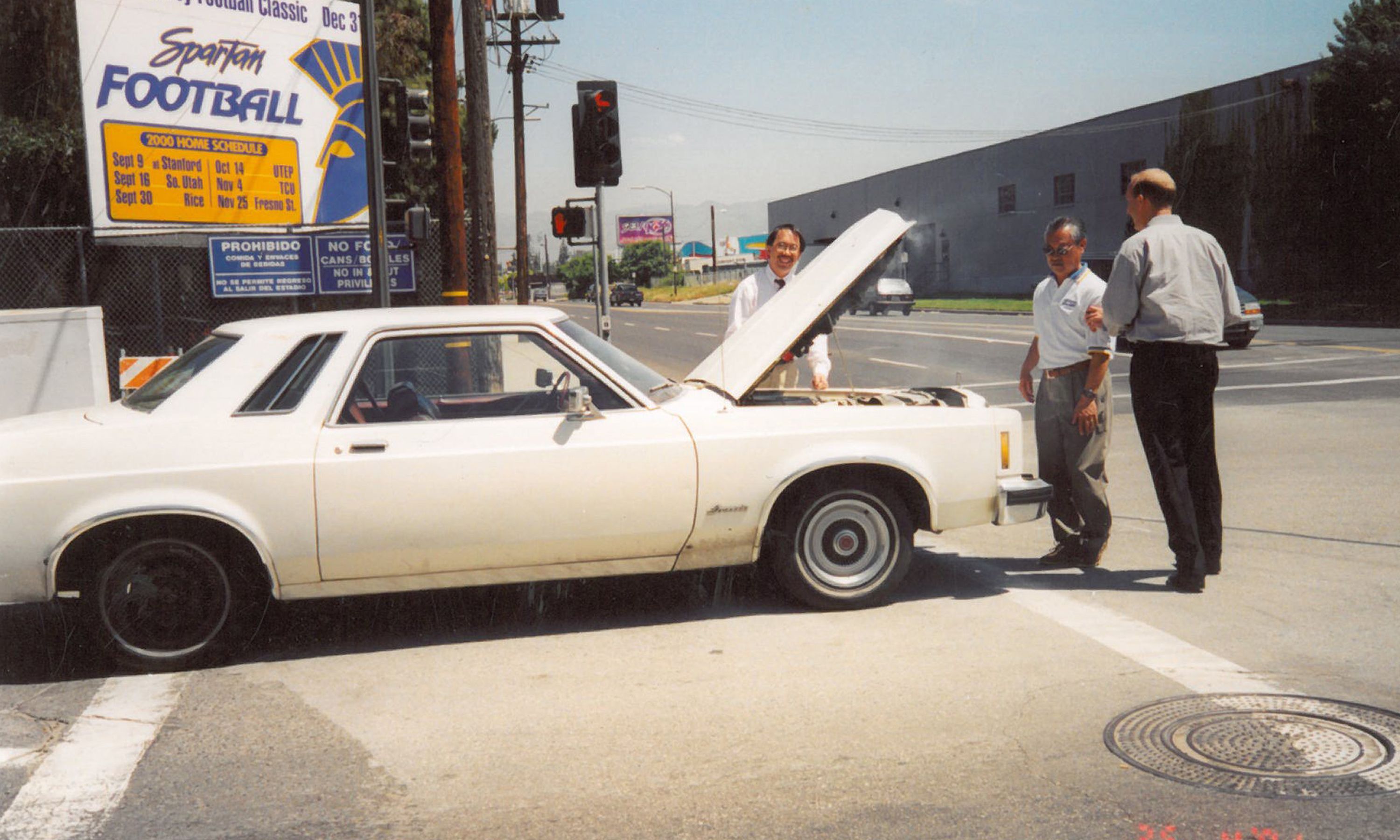 Lawrence Fan with his infamous 1978 Ford Granada car, parked outside SJSU Athletics.