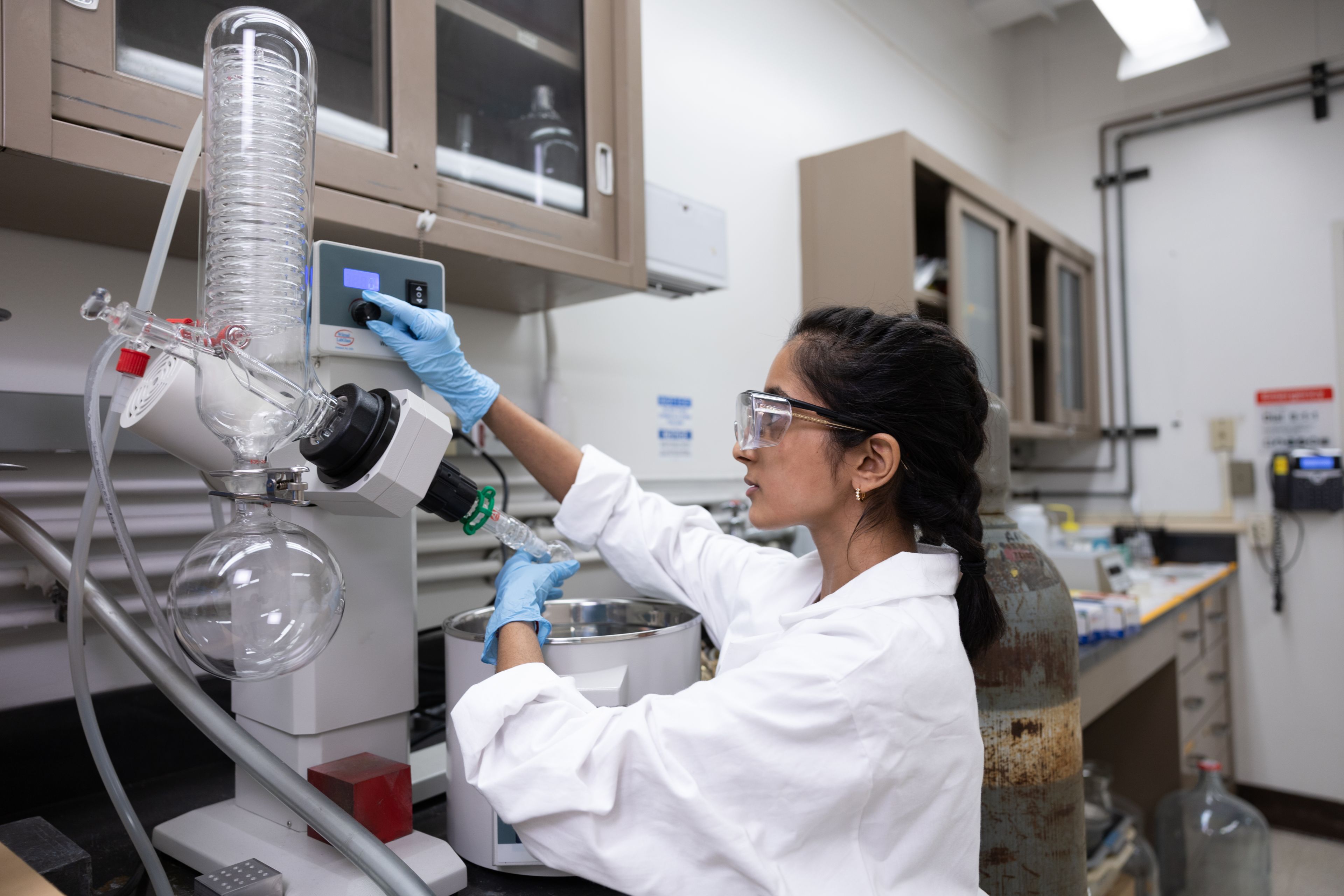 Tara Vaddiraj working with scientific equipment in the NASA lab as part of her ASPIRE internship. NASA, astrobiology, hands-on learning, student life, student researcher