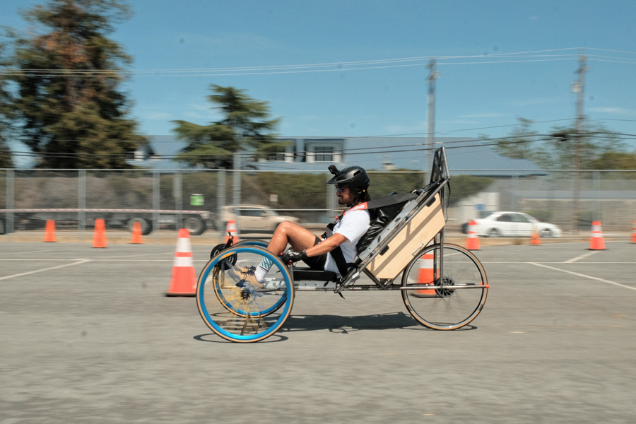 side view of student racing through a cone track on the 2023 SJSU ASME e-HPVC