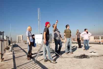 students on DH roof with professor