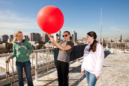 Meteorology students using a weather balloon.