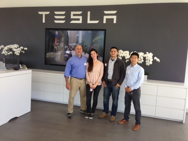 Photo of students and a faculty member at Tesla