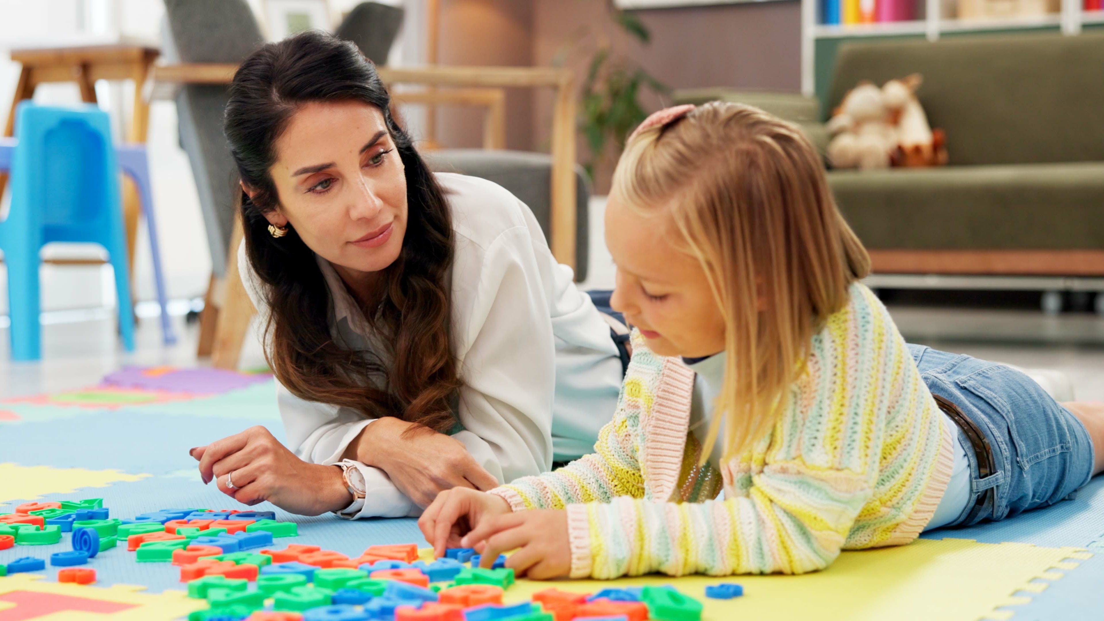 Psychologist observing a child completing a task