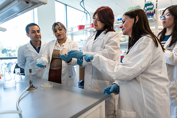 Group of CLS students in lab gear