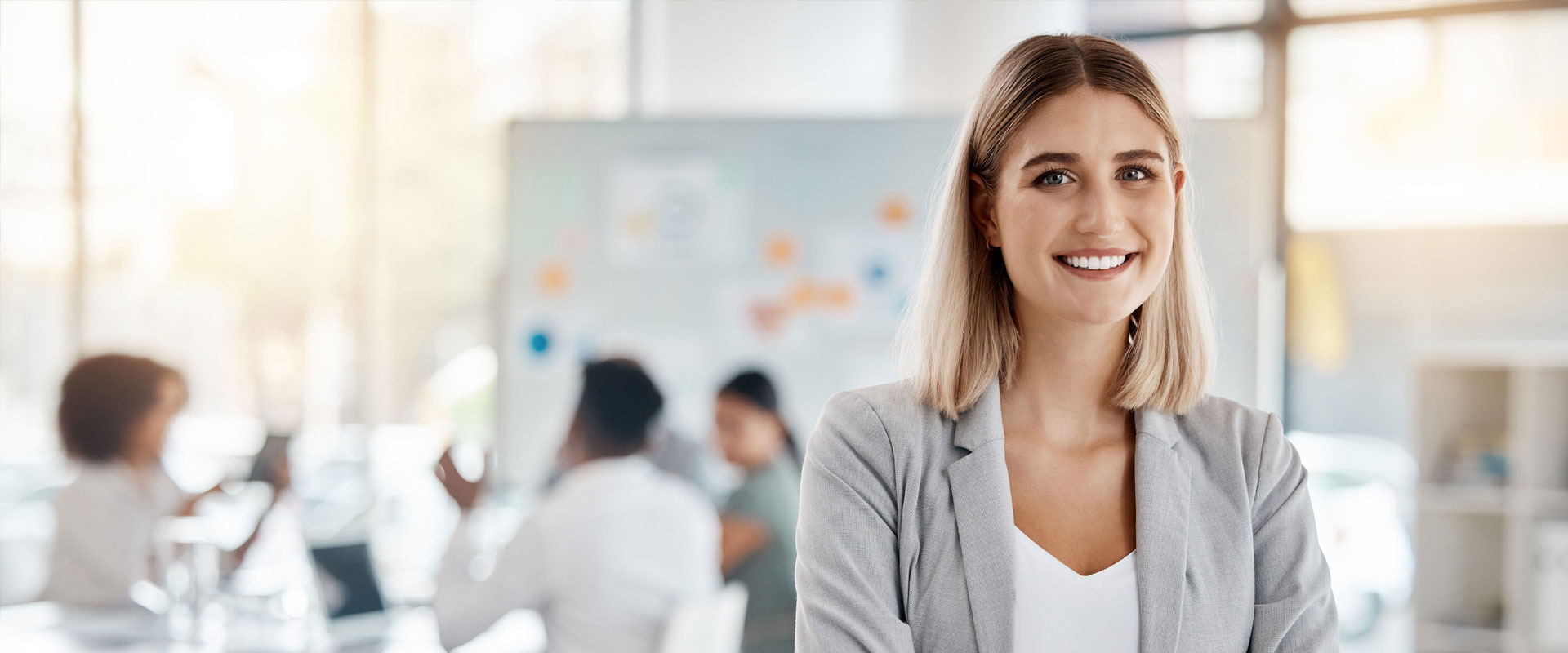 Woman smiling during marketing strategy meeting