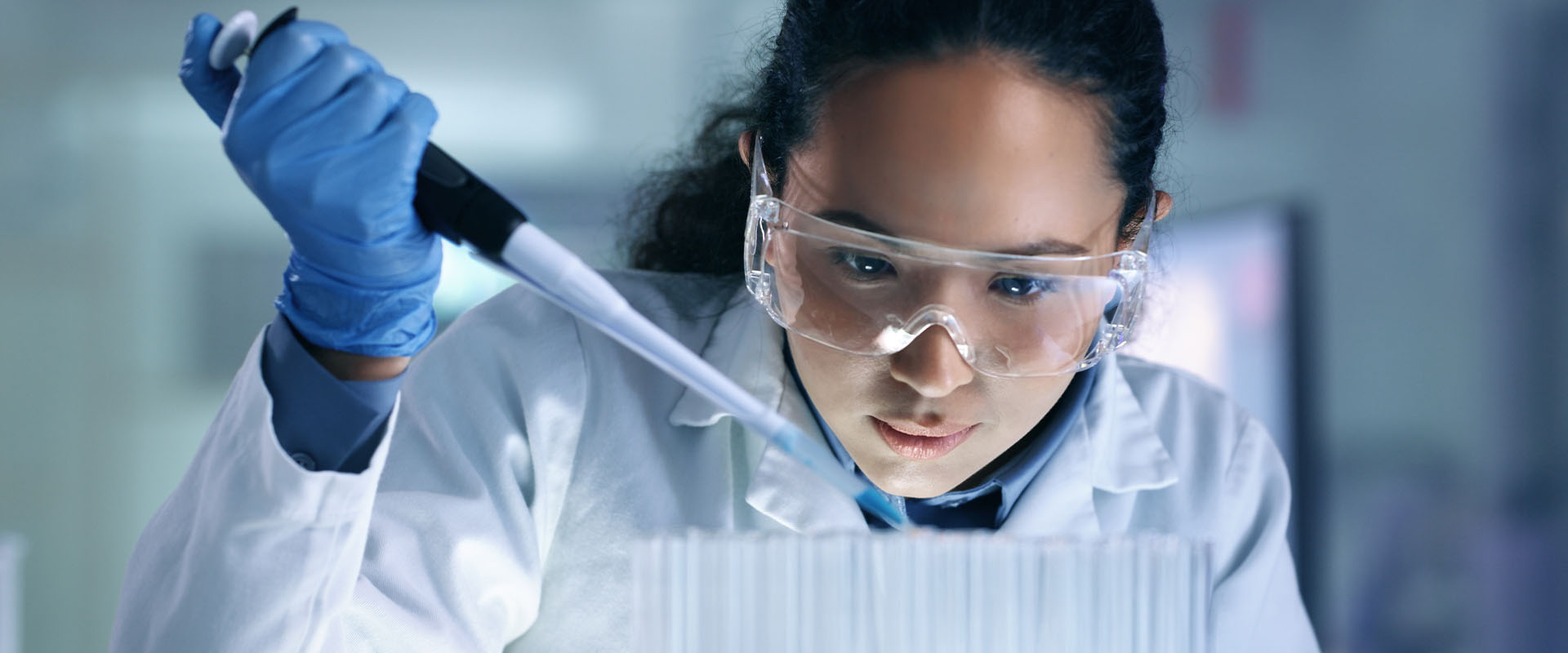 Female healthcare engineer student with lab equipment