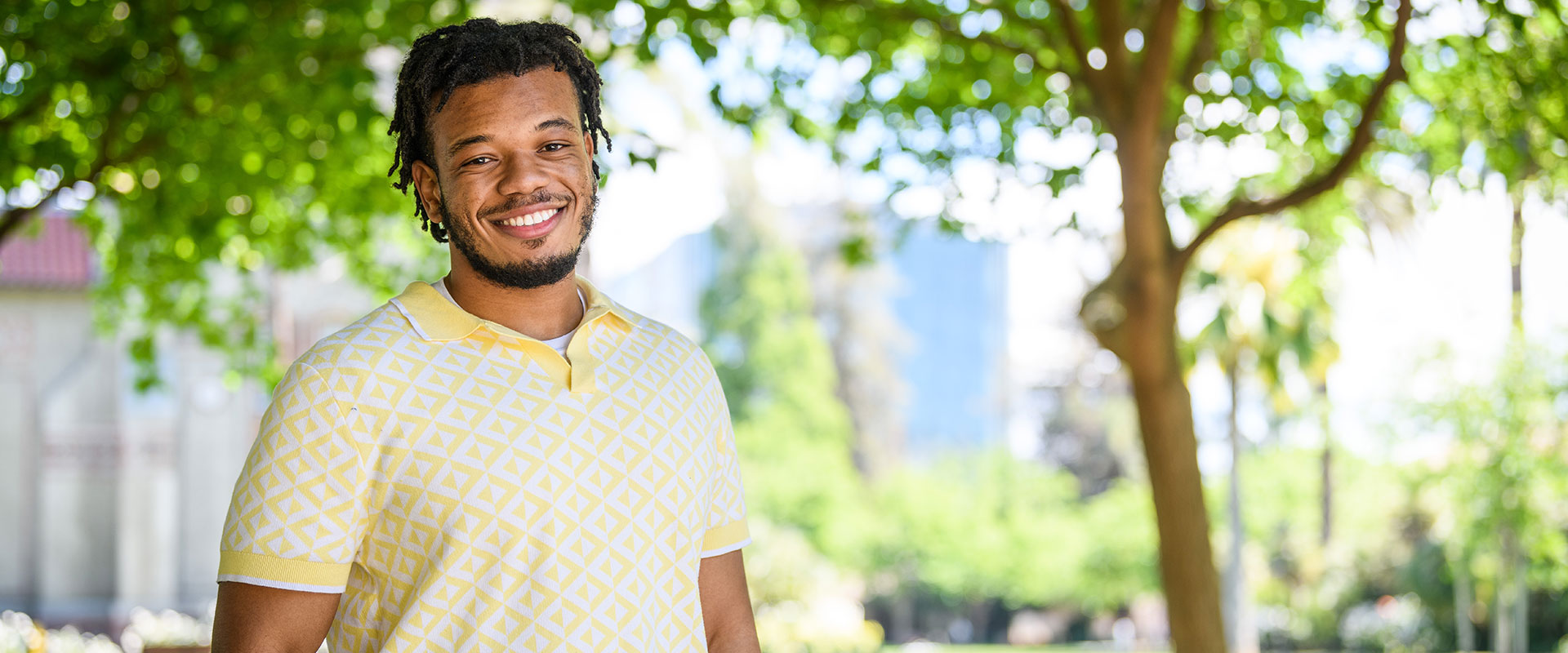 SJSU student posing in front of quad