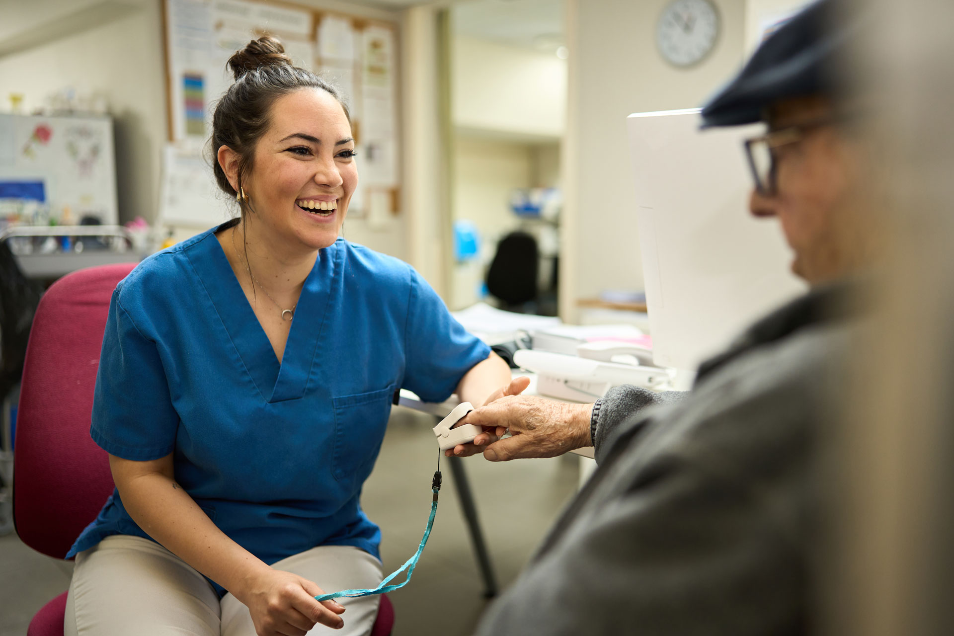 Nurse taking blood pressure of an elderly patient