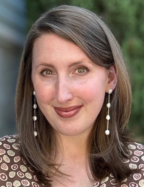 Photo of a smiling woman with light brown hair