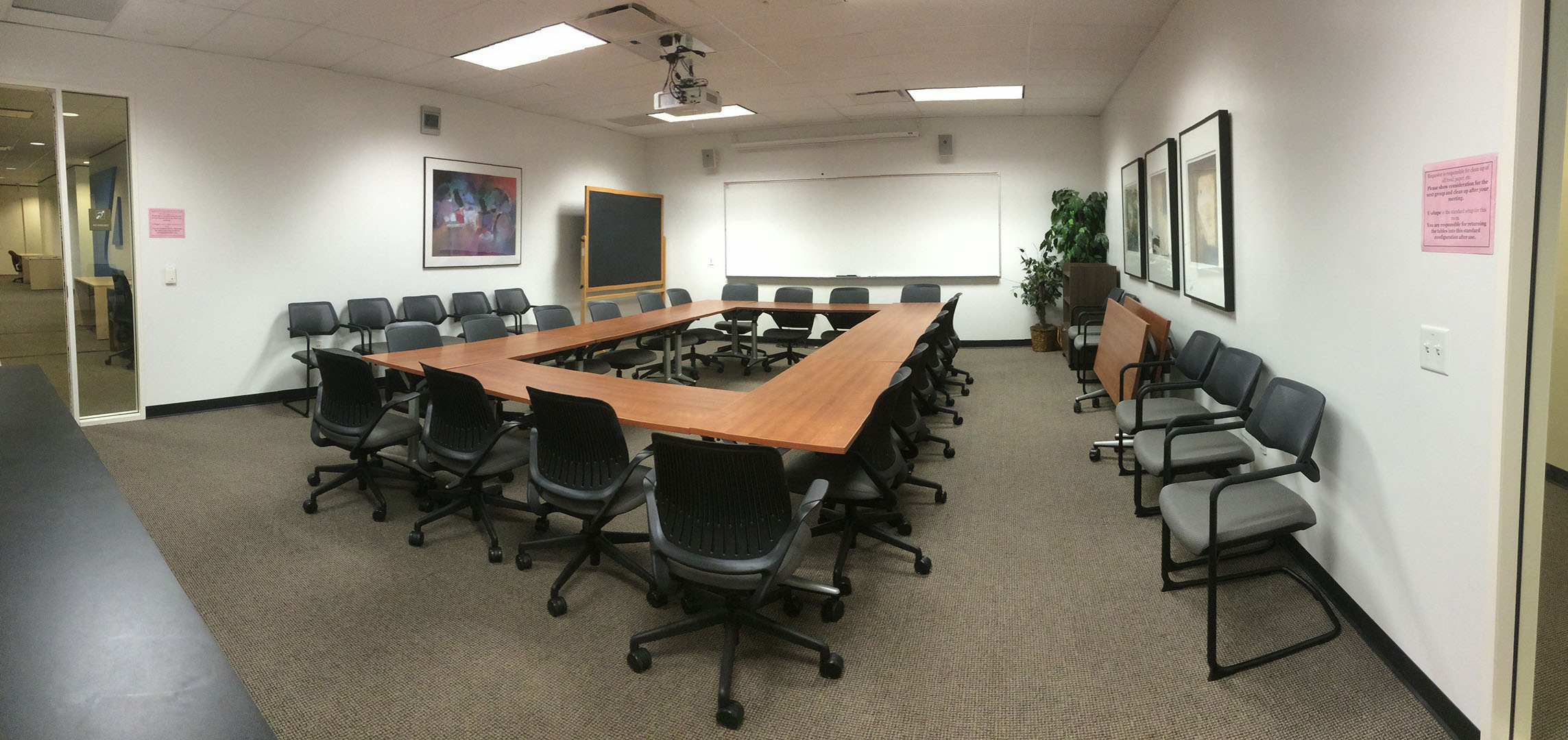 Lower right side view of empty meeting room.