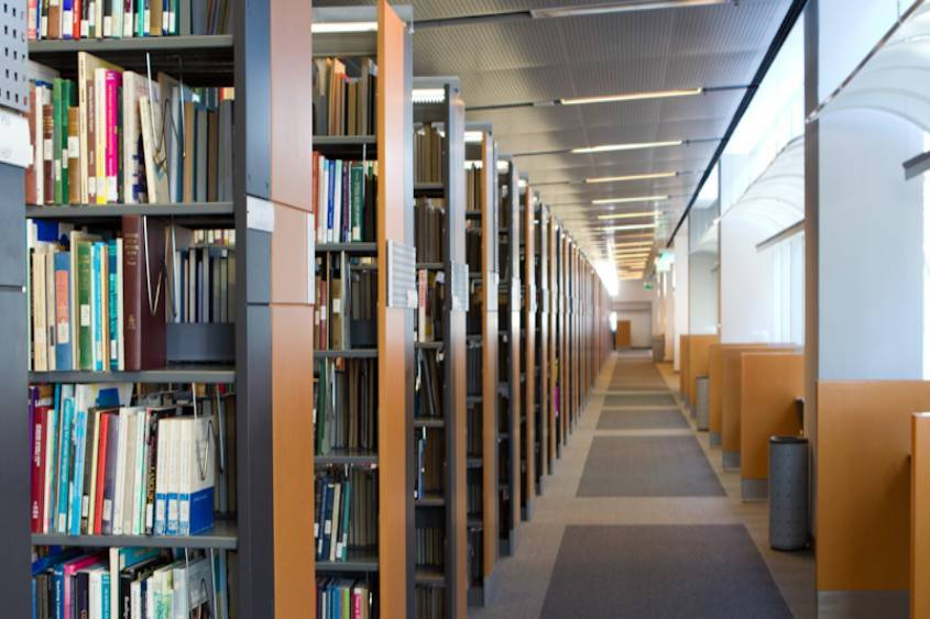 sjsu library books and hallway with desks