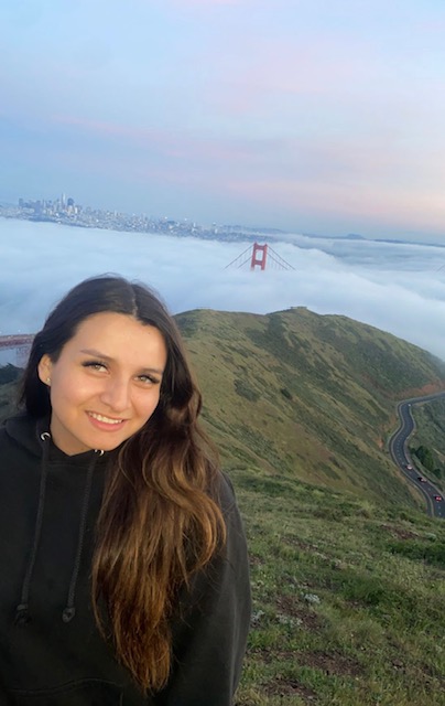 Young woman with golden gate bridge in background