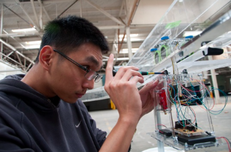 A student working on a mechanical project.