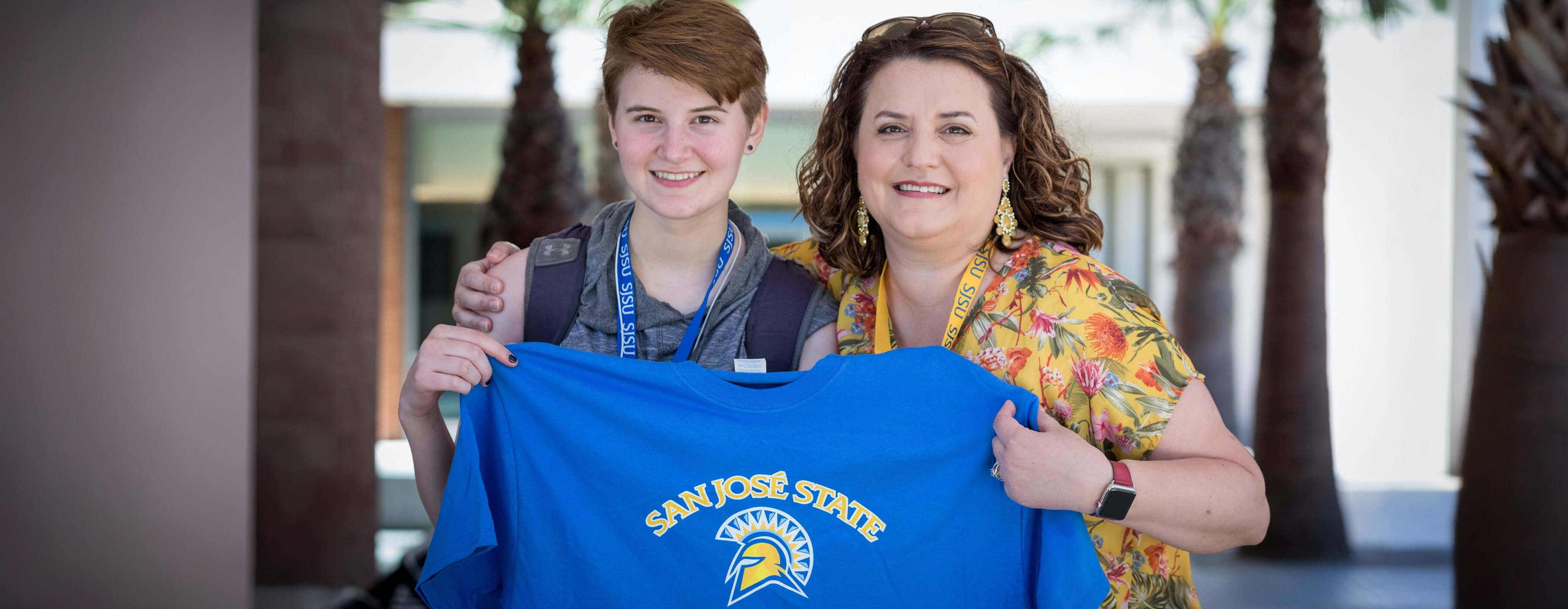 Student holding SJSU tshirt