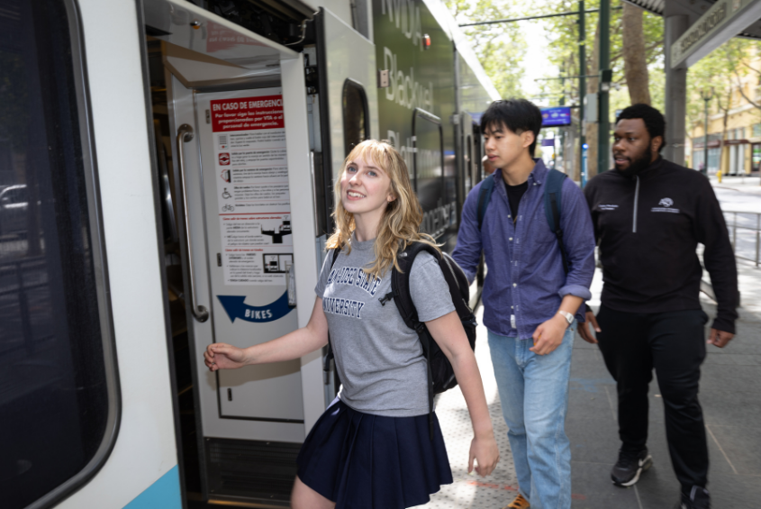 Students boarding a VTA light rail tram