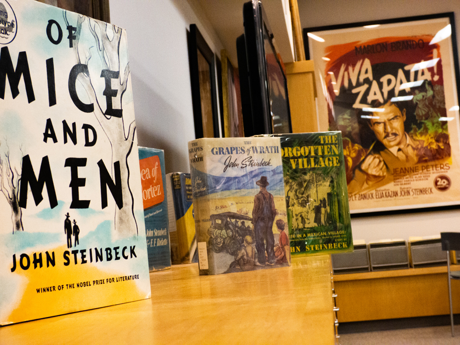 Several of Steinbeck's novels on a cabinet in the Steinbeck Center