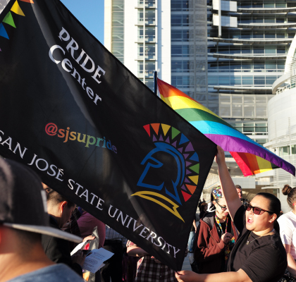 SJSU students holding Pride Center banner
