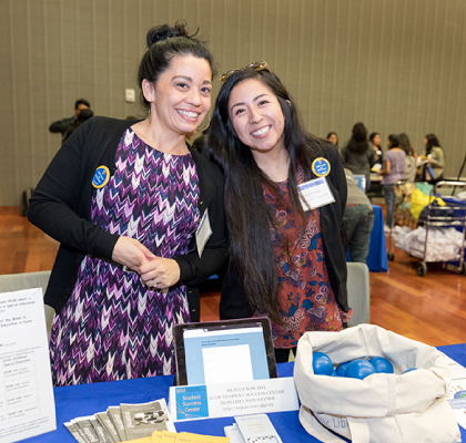 Chicanx/Latinx Students at event table
