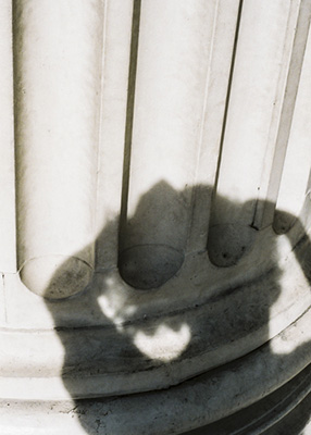 photograph of a shadow cast onto a column