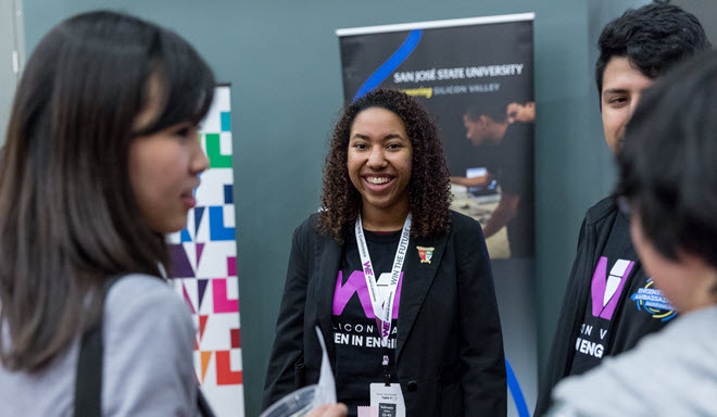 a group of diverse students attend a conference